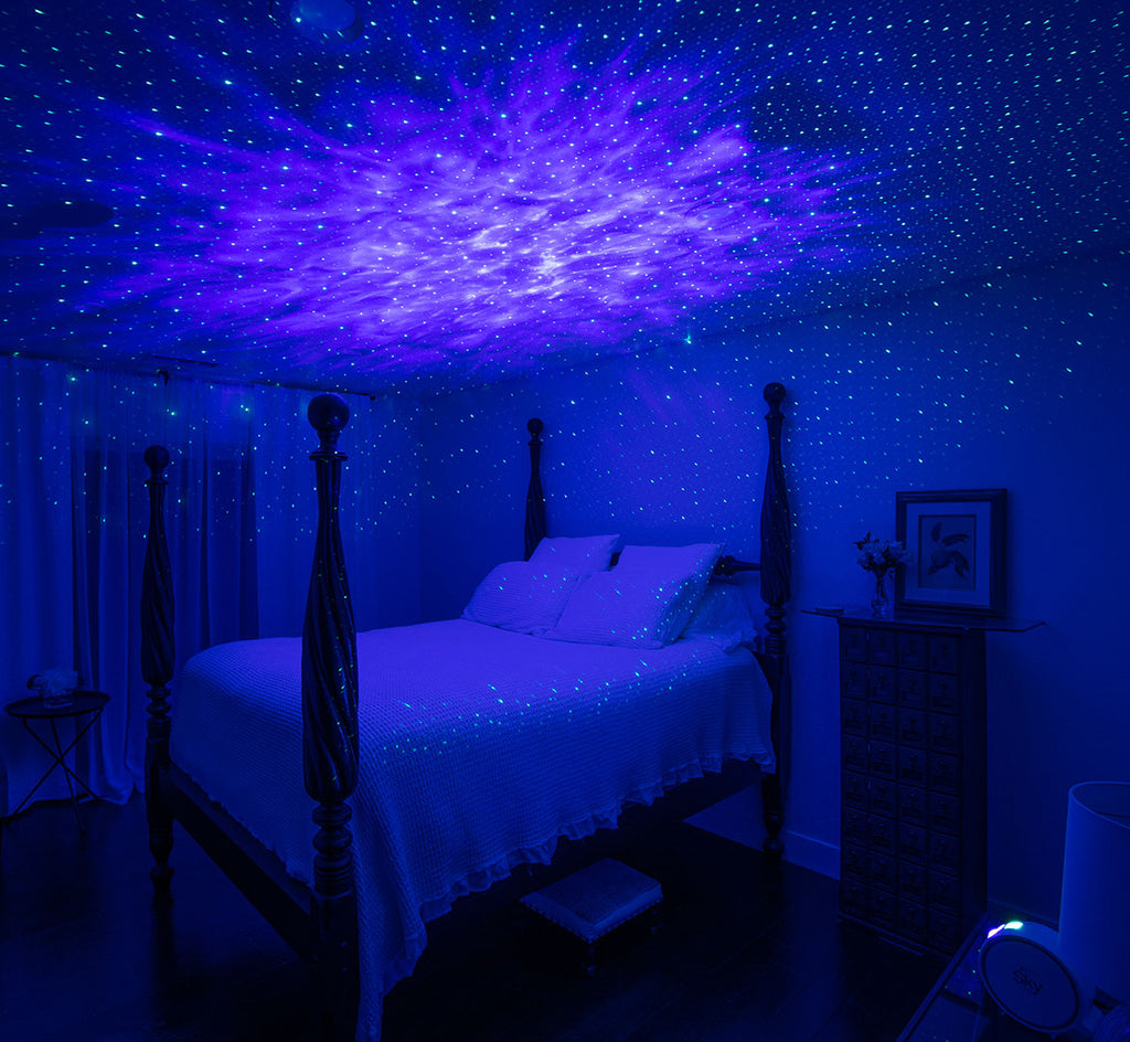 galaxy light over four-poster bed