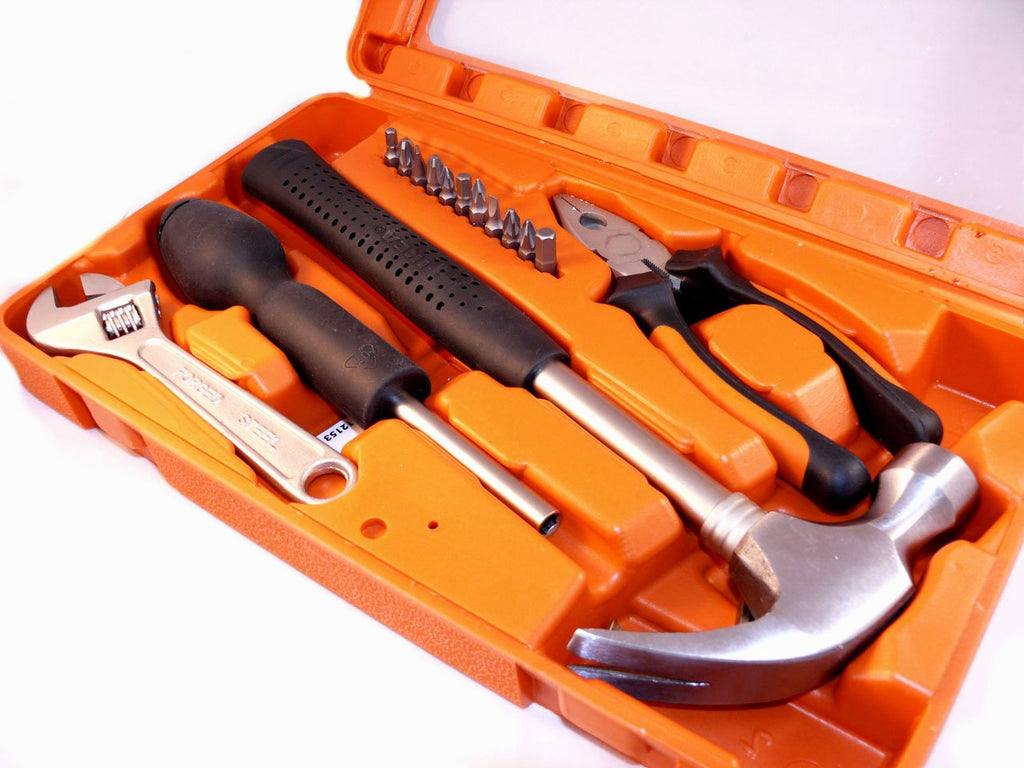 hammer and tools in orange tool box