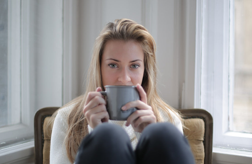 woman with mug of hot tea