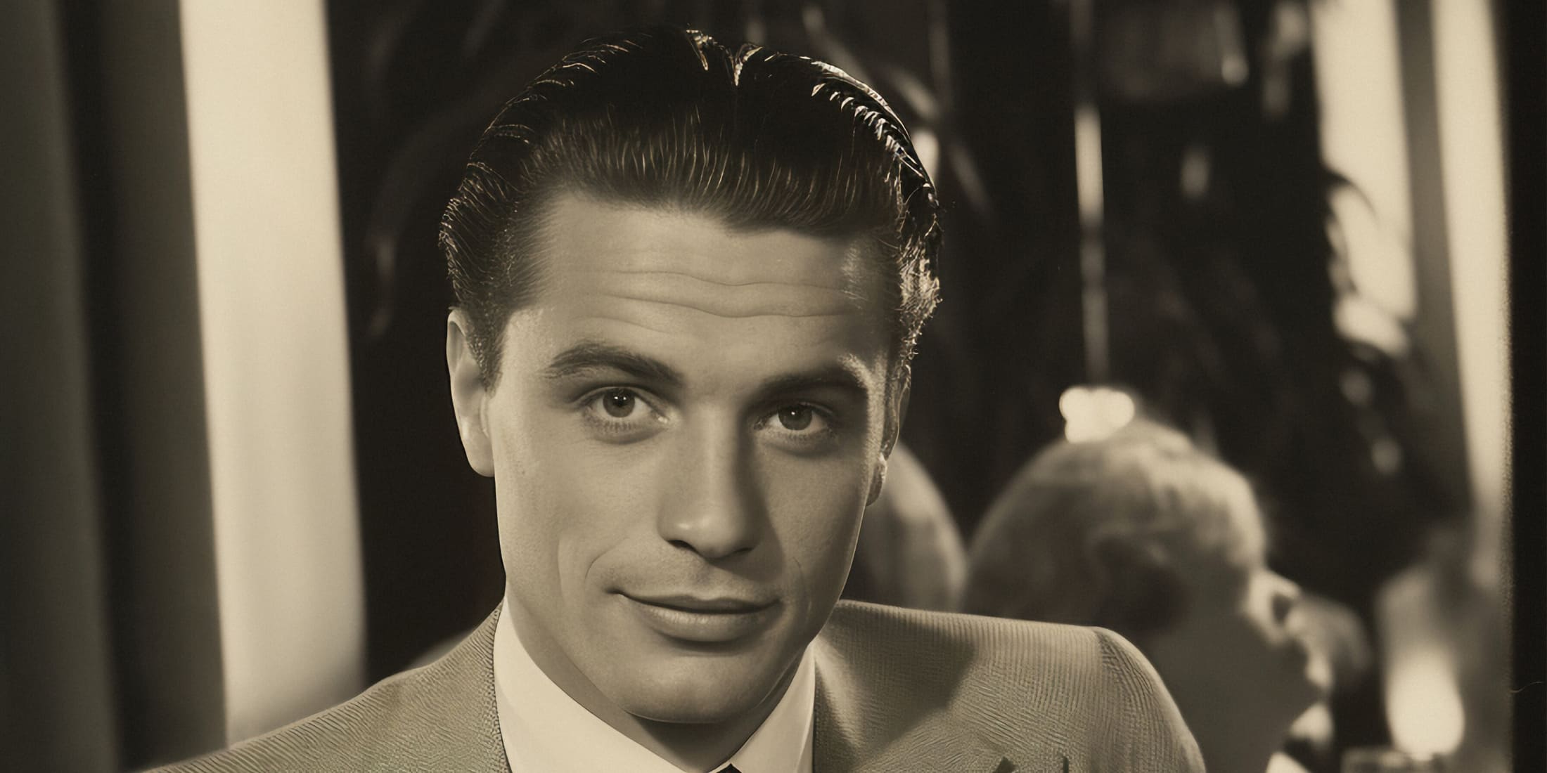 Classic 1940s men's haircut featuring a sleek, slicked-back style on a man in a suit, highlighting the timeless elegance and grooming trends of the 1940s.