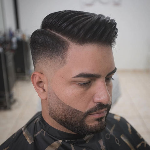 Close-up of a man with a comb over hairstyle, featuring a neatly defined side part and a smooth fade. This classic men's hairstyle exudes sophistication and control, making it an ideal choice for a polished, professional look that’s both timeless and versatile.