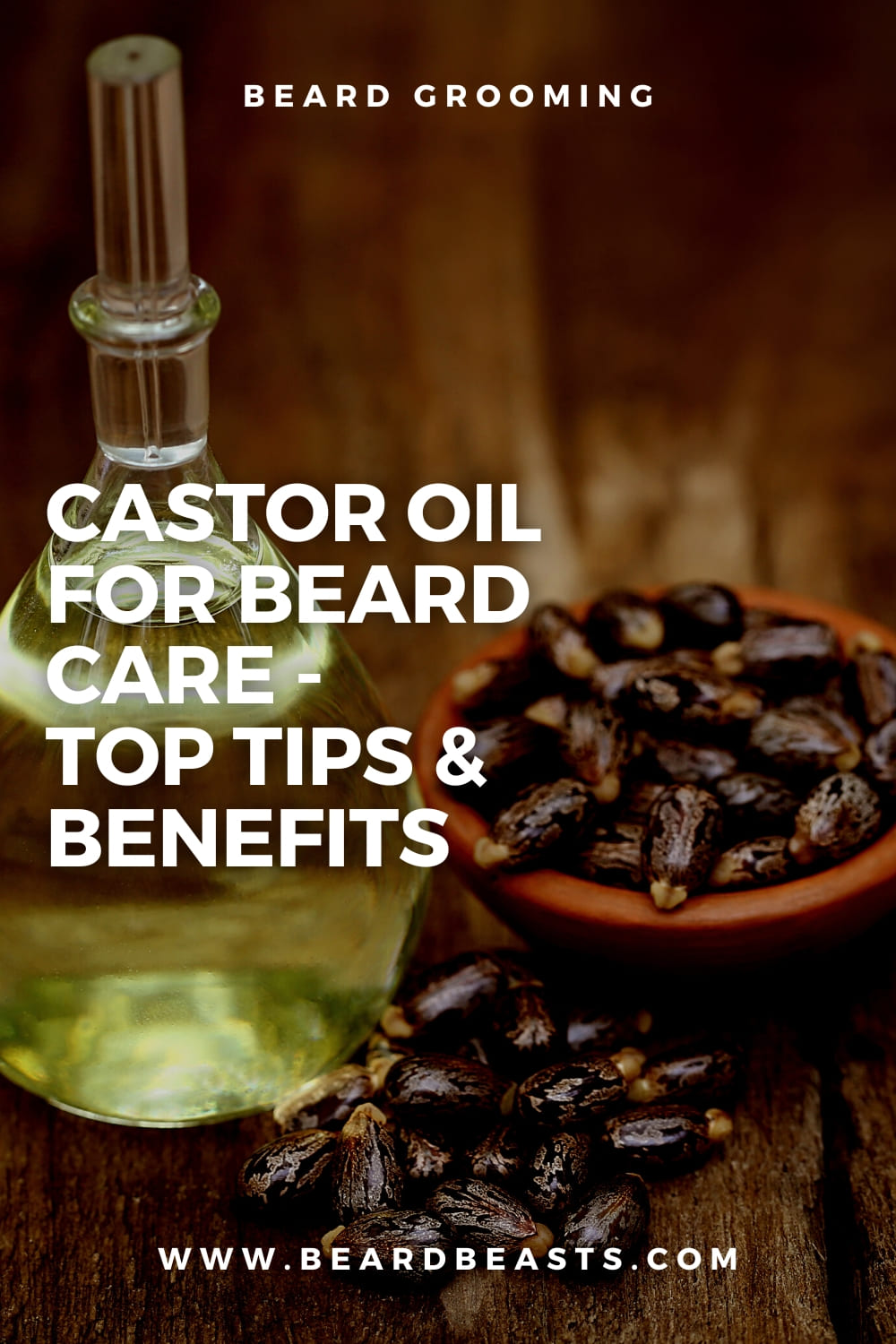 Glass bottle of castor oil and bowl of castor beans on a wooden surface with text overlay - Castor Oil for Beard Care - Top Tips & Benefits - Beard Grooming - www.beardbeasts.com