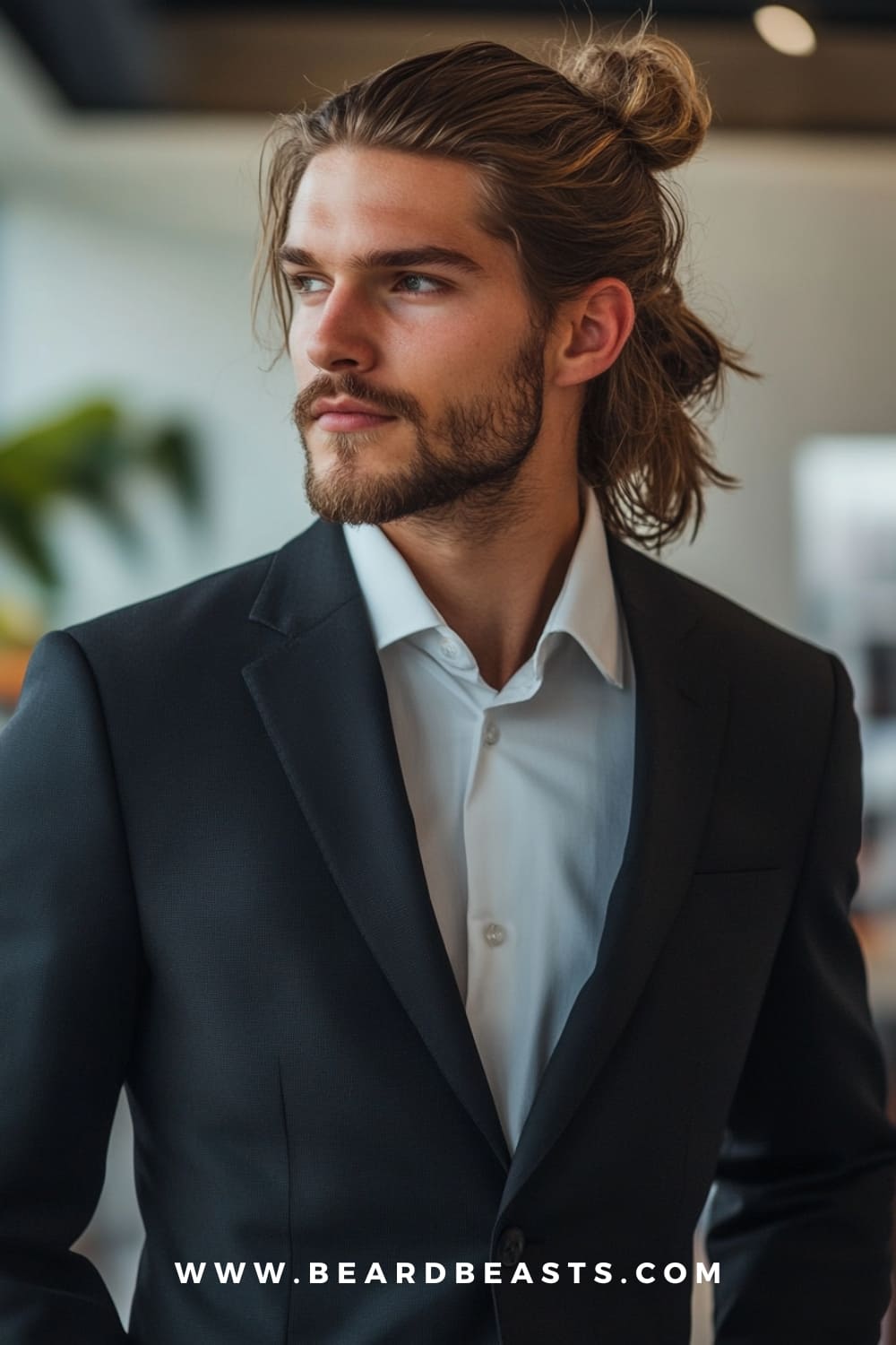 Half-Up, Half-Down - A stylish and versatile Long Professional Men’s Hairstyle featuring a neat top knot with the rest of the hair left down, perfect for a modern yet polished business look.