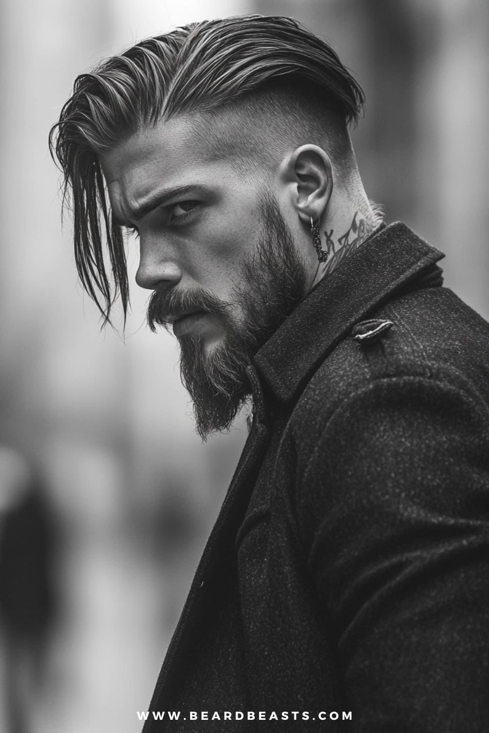 Man with long, slicked-back hair paired with a bold undercut, a well-groomed beard, and visible tattoos, creating a striking and edgy appearance. The sharp contrast between the shaved sides and flowing top makes this a standout example of men's hairstyles for long hair, blending rugged style with modern attitude.