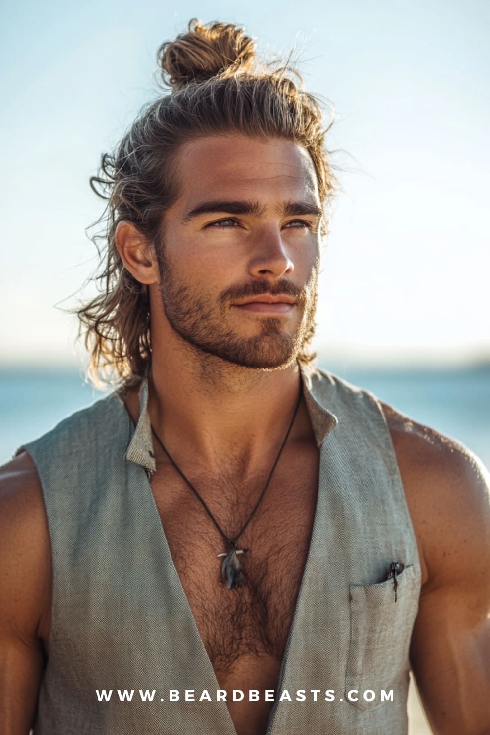 A man with a long half-up, half-down hairstyle and a light beard, showcasing one of the best Long Surfer Hairstyles. The casual yet stylish look combines practicality with a laid-back surfer vibe, perfect for a beach-ready appearance.