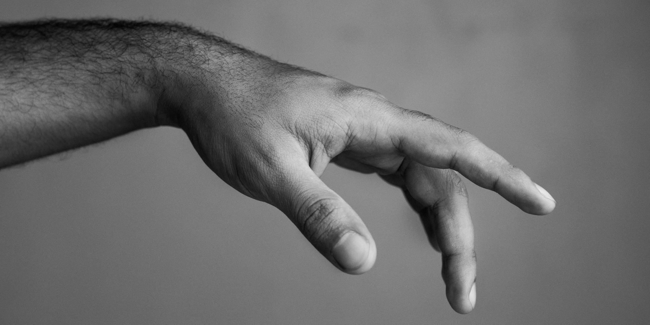 A close-up of a man's hand showcasing well-groomed fingernails, emphasizing the importance of proper nail care as part of men's hygiene. The image highlights the importance of keeping nails clean, trimmed, and healthy for a polished appearance.