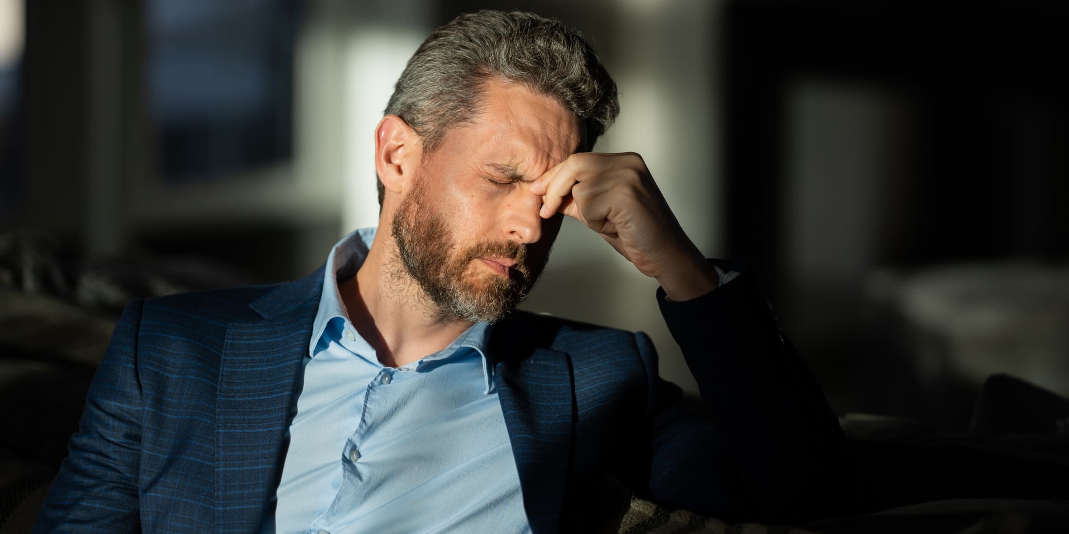 Man experiencing high stress, illustrating the need for effective stress management techniques to improve men's mental health and achieve stress relief for men