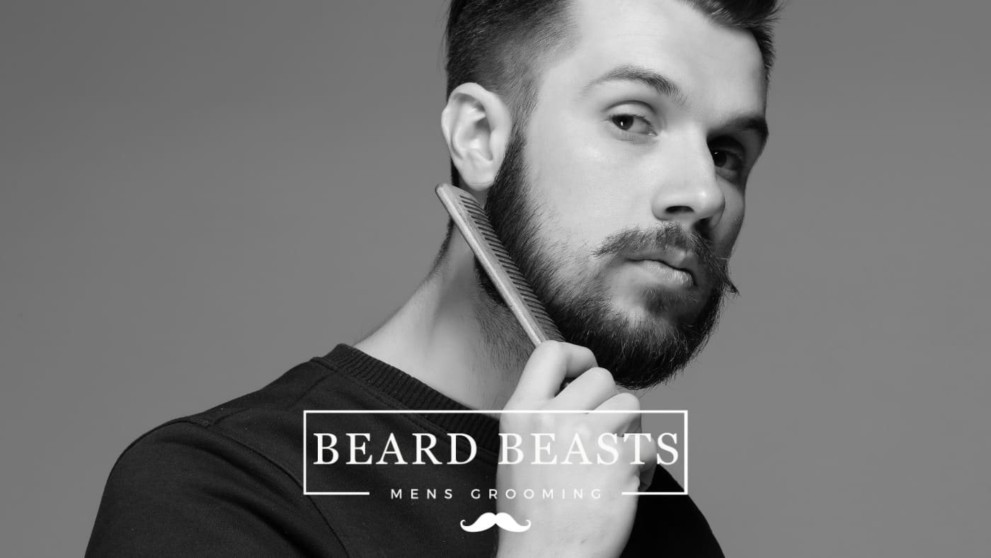 A man with a styled thin beard combing his beard, with the logo "BEARD BEASTS - MEN'S GROOMING" displayed in the image.