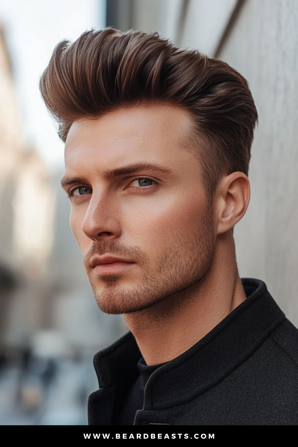 A sharp, stylish man wearing a perfectly groomed pompadour haircut. His hair is neatly swept back with noticeable volume at the top, showcasing the classic pompadour shape while maintaining a sleek, modern finish. The sides are kept short and clean, further accentuating the height and texture of the voluminous top. Dressed in a black jacket, his look is both sophisticated and striking, embodying a timeless sense of elegance and confidence. The natural lighting highlights the smooth texture of his hair and the defined angles of his facial features, creating a polished and refined appearance.