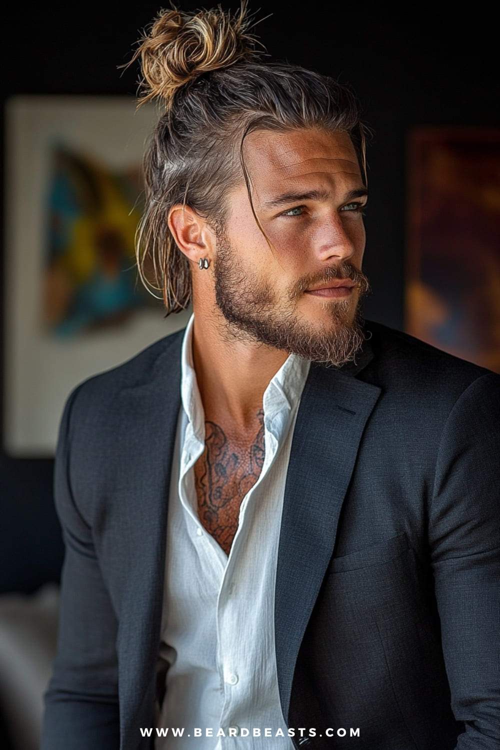 Man sporting a man bun, with long hair neatly tied up at the back of the head, offering a laid-back yet refined look. Loose strands frame the face, adding to the relaxed aesthetic. Paired with a well-tailored black suit, a partially unbuttoned white shirt, and subtle accessories, this hairstyle is a perfect blend of casual and formal. The man bun is a great option for men looking to maintain long hair in a sleek, controlled style for formal events.