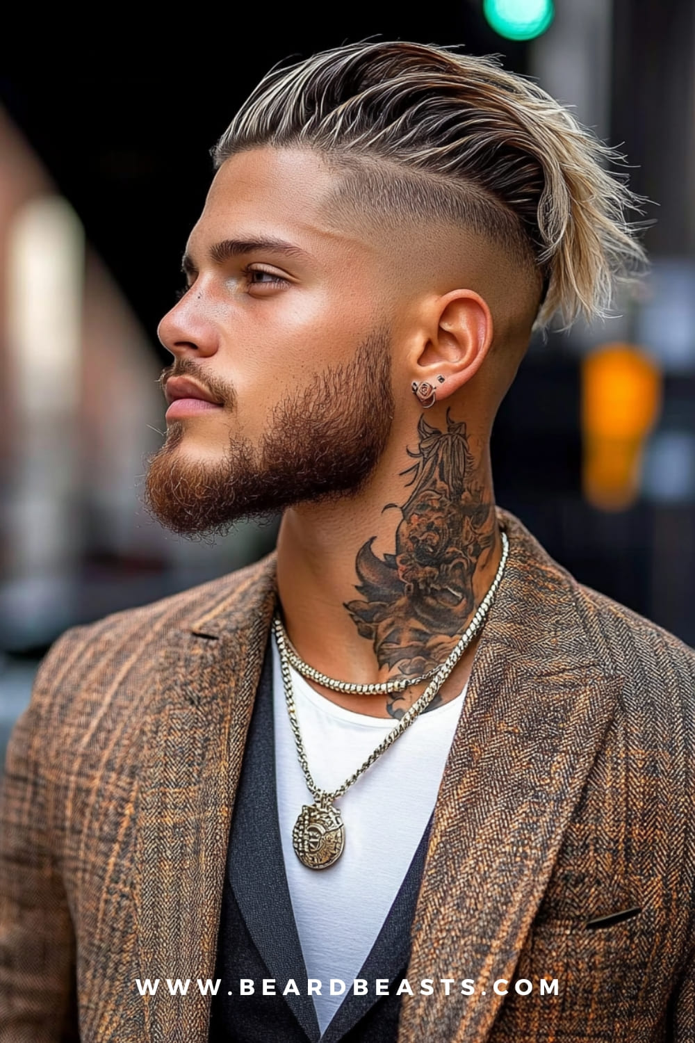 A man showcasing a bold undercut hairstyle with long, slicked-back blonde hair on top and shaved sides. Paired with a full beard and intricate neck tattoos, this stylish men's haircut offers a striking and edgy appearance.