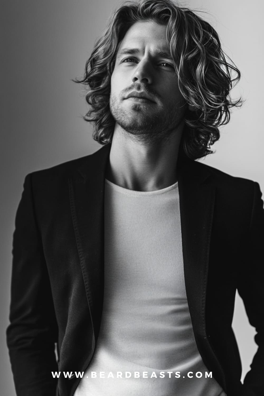 Shoulder-Length Waves - A natural and flowing Long Professional Men’s Hairstyle featuring relaxed waves at shoulder length, perfect for a stylish yet polished look in creative or relaxed corporate environments.