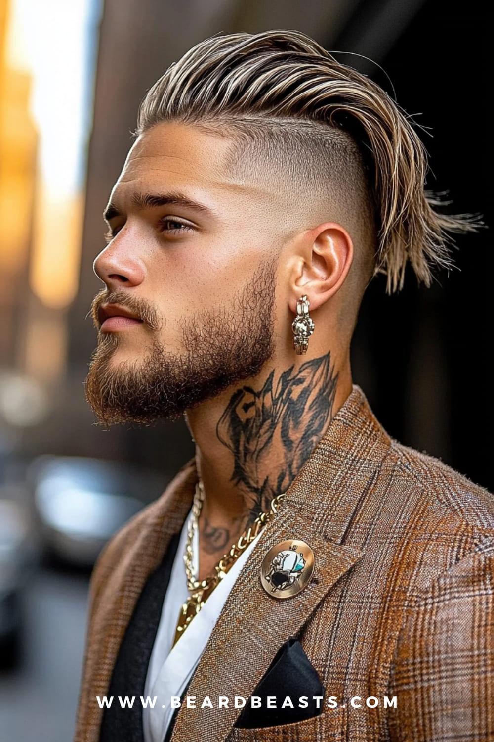 Man with a slick back undercut, styled with long textured hair on top and shaved sides, paired with a well-groomed beard. The slick back undercut is a trendy option among low maintenance haircuts for men, offering a bold, stylish look with minimal daily effort.