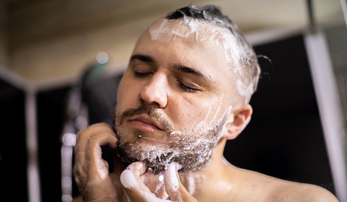 a man washing his beard