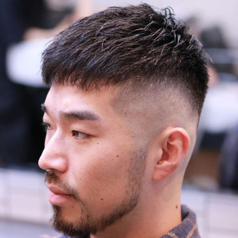 Man with a stylish Textured Crop haircut, featuring a short, tousled top and a clean fade on the sides. The texture on top adds volume and movement, creating a modern, edgy look that’s perfect for men who want a low-maintenance yet fashionable short hairstyle for men.