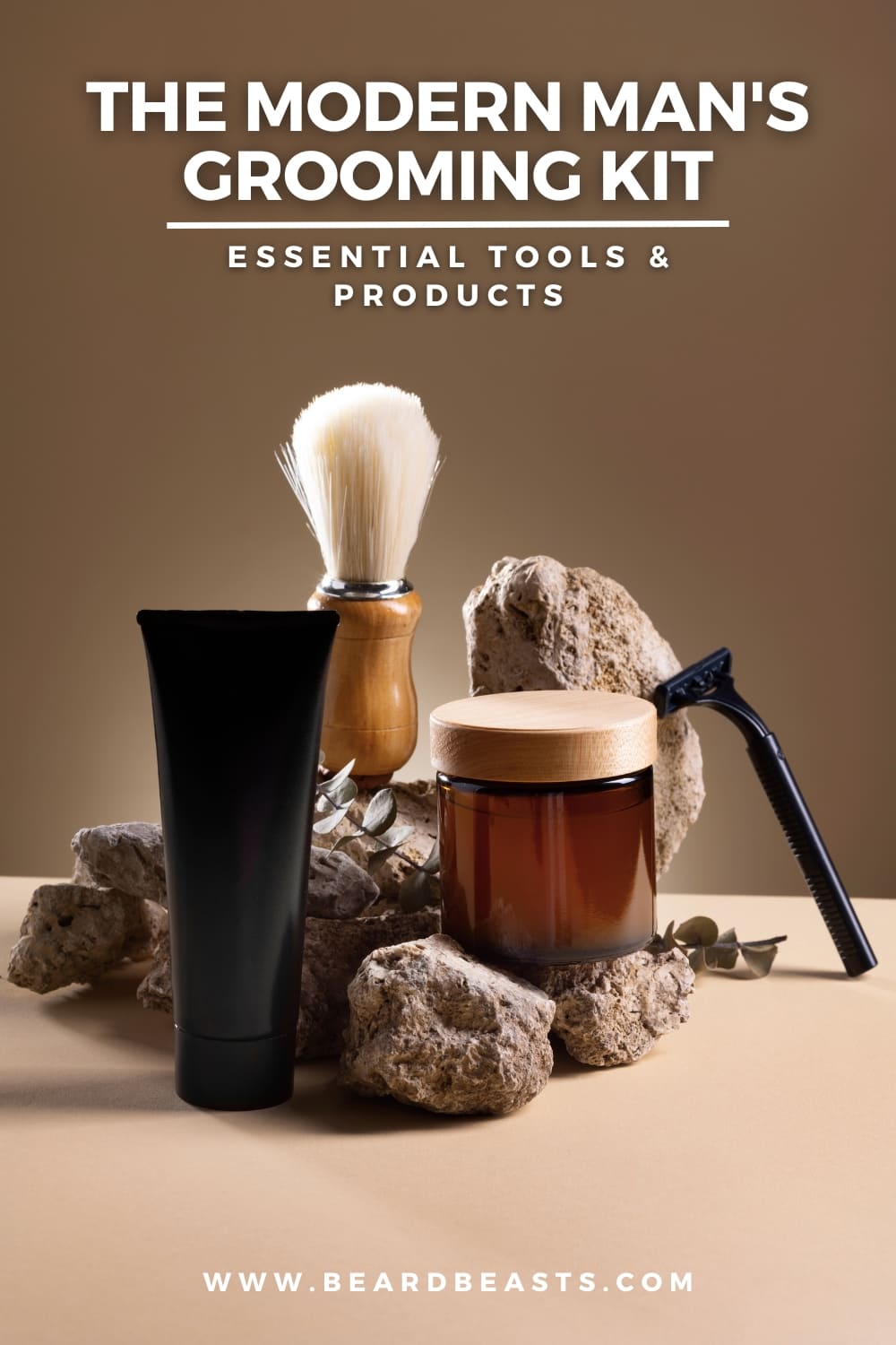 An image showcasing a modern men's grooming kit with essential tools and products, including a shaving brush, a tube of grooming cream, a jar with a wooden lid, and a razor. The items are placed on natural stone elements, giving the setup an earthy, rustic feel. The text 'The Modern Man's Grooming Kit: Essential Tools & Products' is displayed at the top, and a website URL 'www.beardbeasts.com' is shown at the bottom.