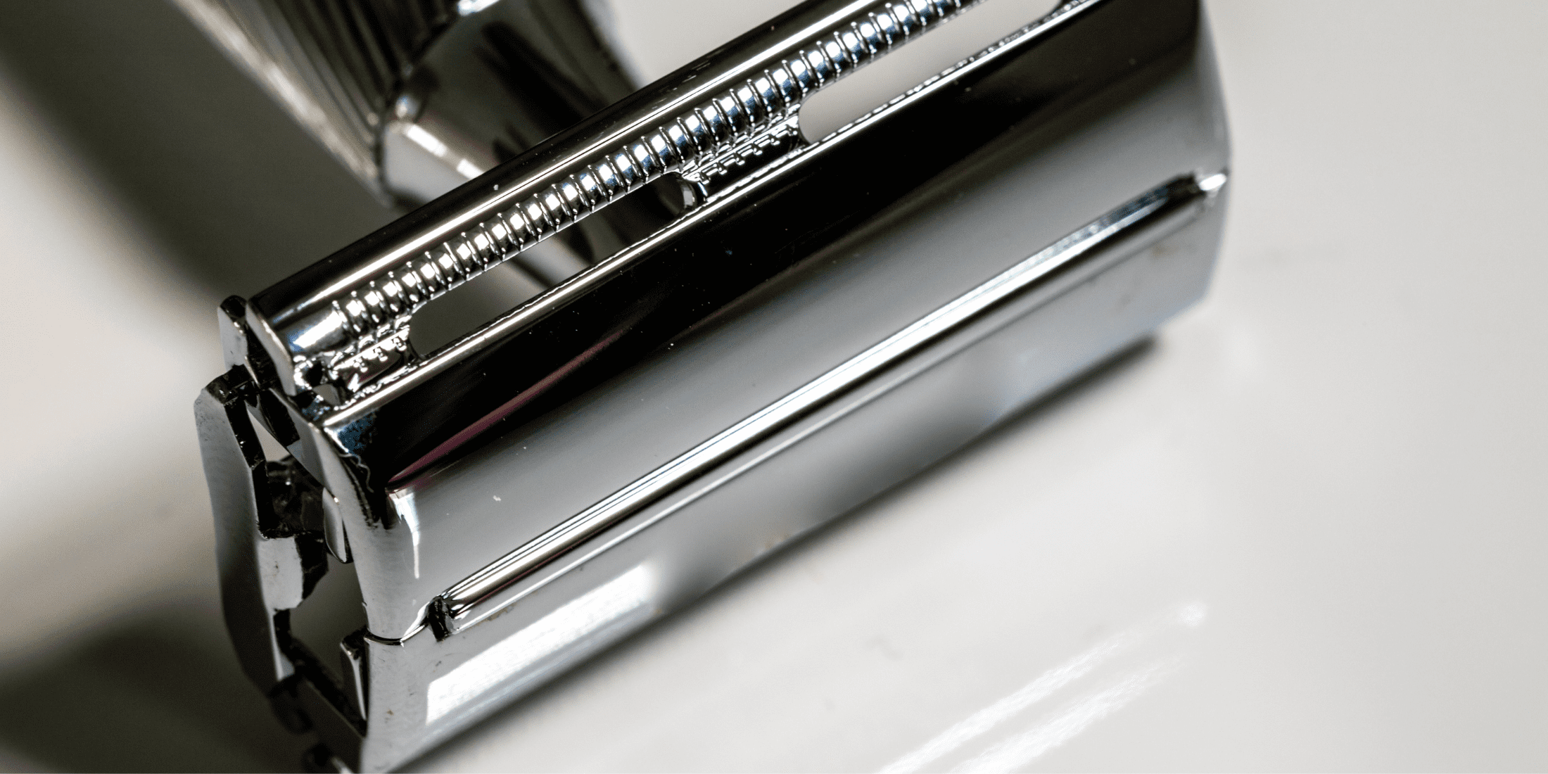 Close-up of a single-blade razor, highlighting its sleek design and precision blade. Ideal for showcasing the benefits of traditional shaving tools in the single blade razor vs multi blade razor debate