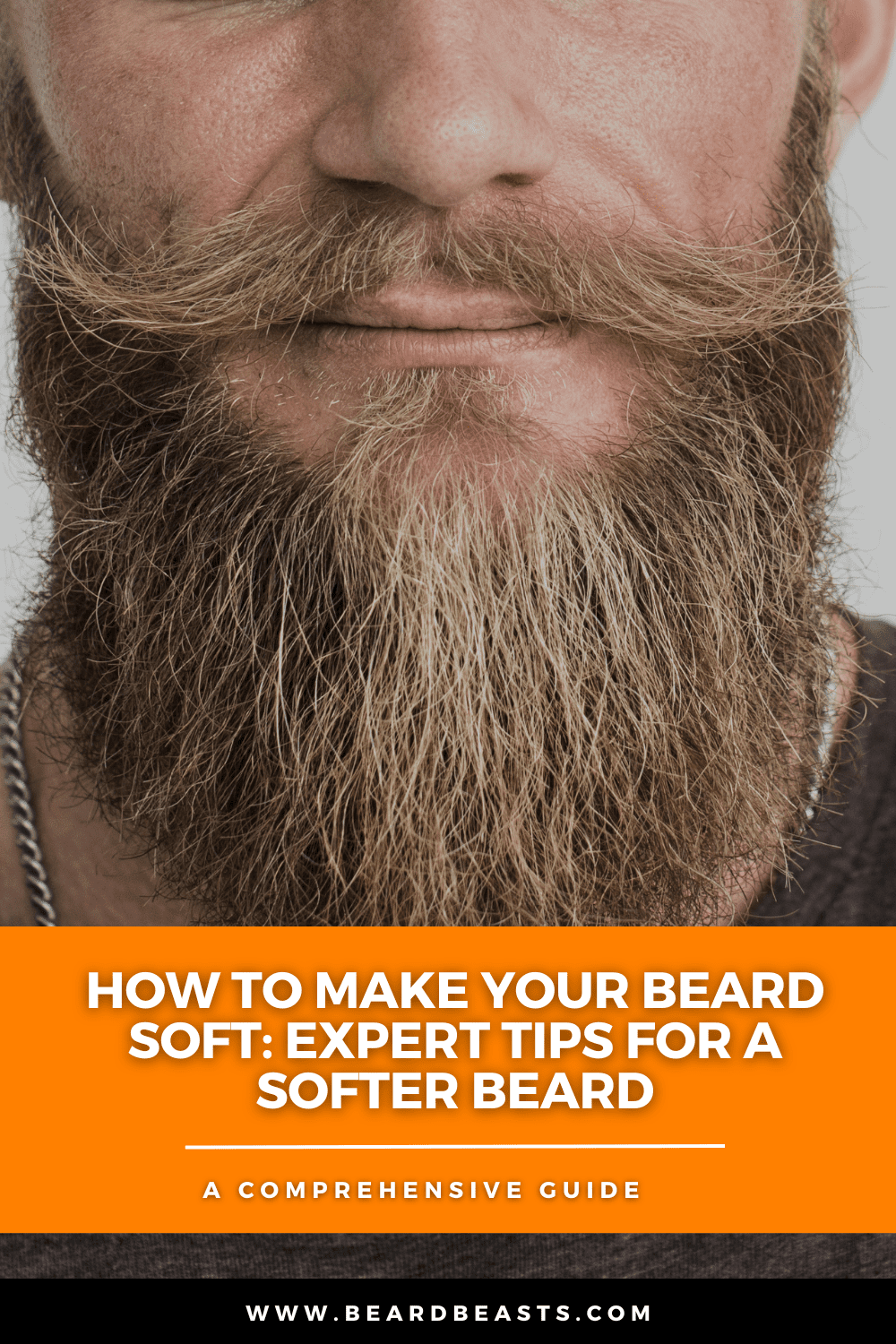 A close-up image of a man with a well-groomed, full beard and styled mustache. The text overlay reads, "How to Make Your Beard Soft: Expert Tips for a Softer Beard - A Comprehensive Guide." The image highlights the importance of beard grooming and care for achieving a soft, healthy beard. This is ideal for an article providing expert tips and comprehensive advice on beard care.